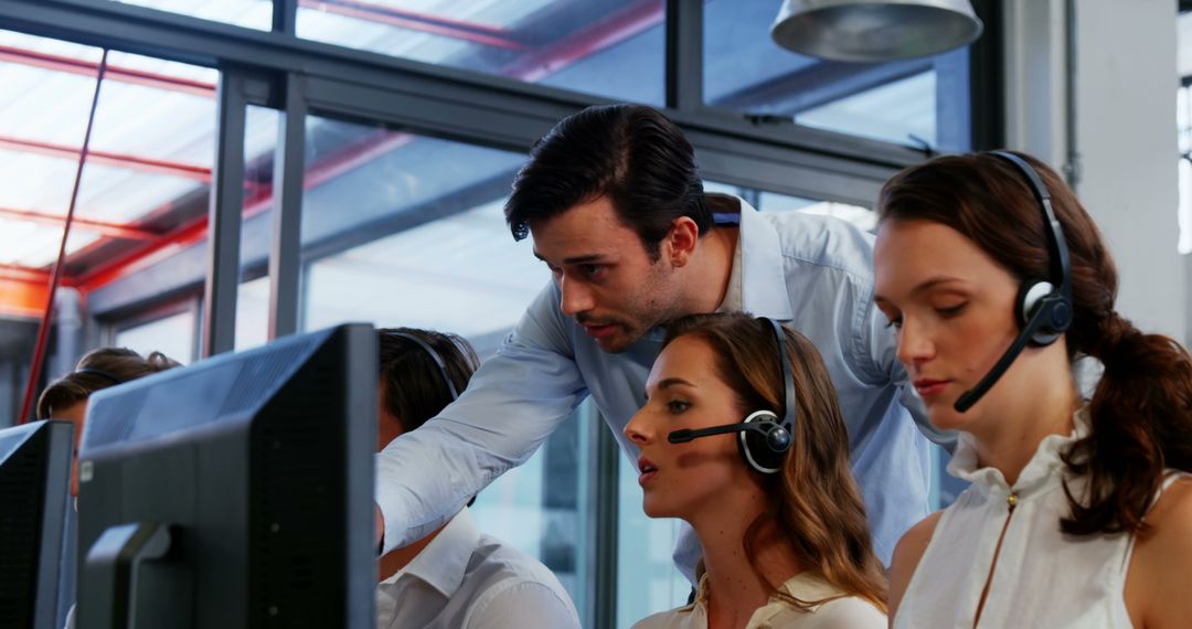 Team of Customer Service Representatives Using Headsets in Modern Office - Free Images, Stock Photos and Pictures on Pikwizard.com