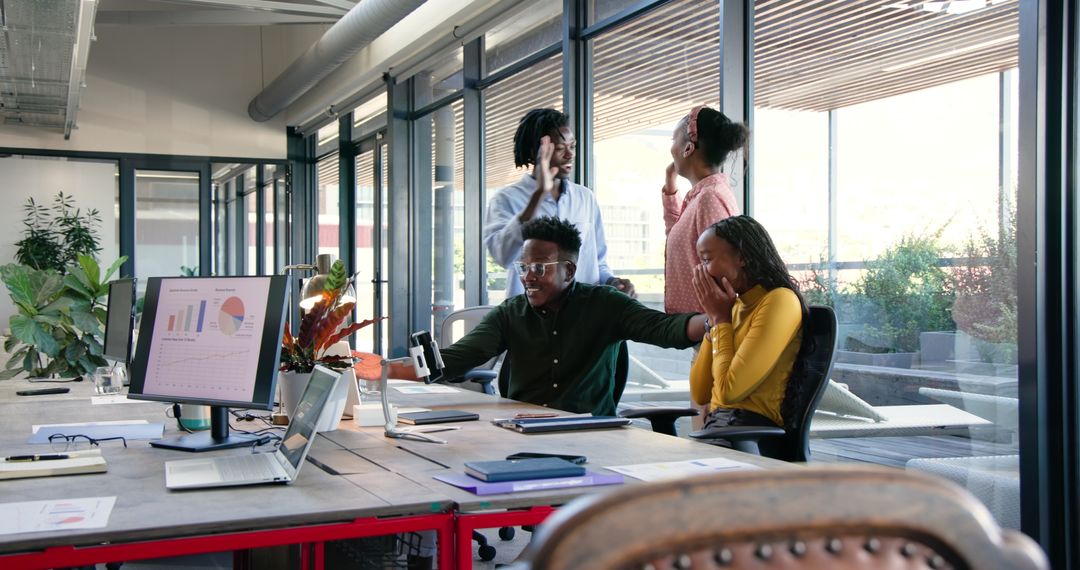 Enthusiastic Team Collaboration in Modern Office Setting