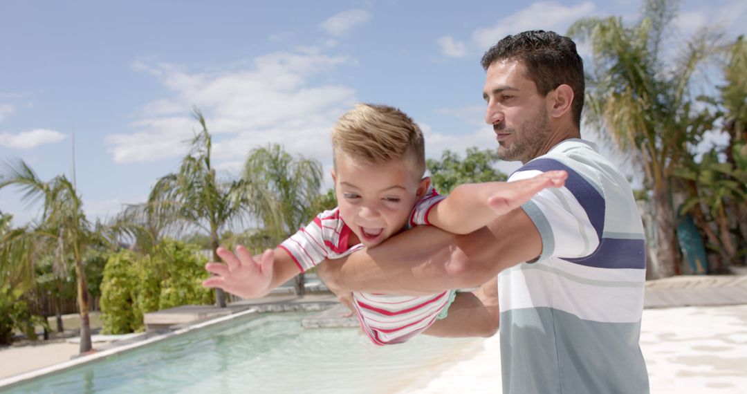 Father and Son Playing by Pool on Sunny Summer Day - Free Images, Stock Photos and Pictures on Pikwizard.com