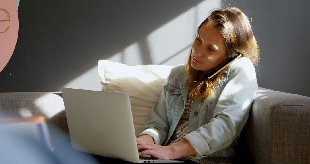 Young Woman Telecommuting on Couch with Laptop in Cozy Home Setting - Free Images, Stock Photos and Pictures on Pikwizard.com