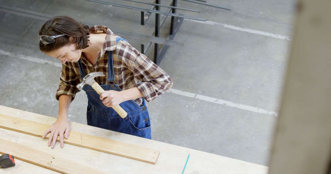 Young Woman Engaging in Carpentry Workshop Projects - Free Images, Stock Photos and Pictures on Pikwizard.com