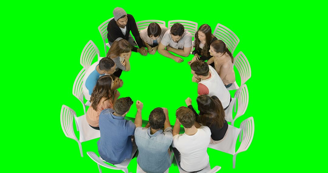 Group of Diverse People Sitting in a Circle Discussing on Green Background - Free Images, Stock Photos and Pictures on Pikwizard.com