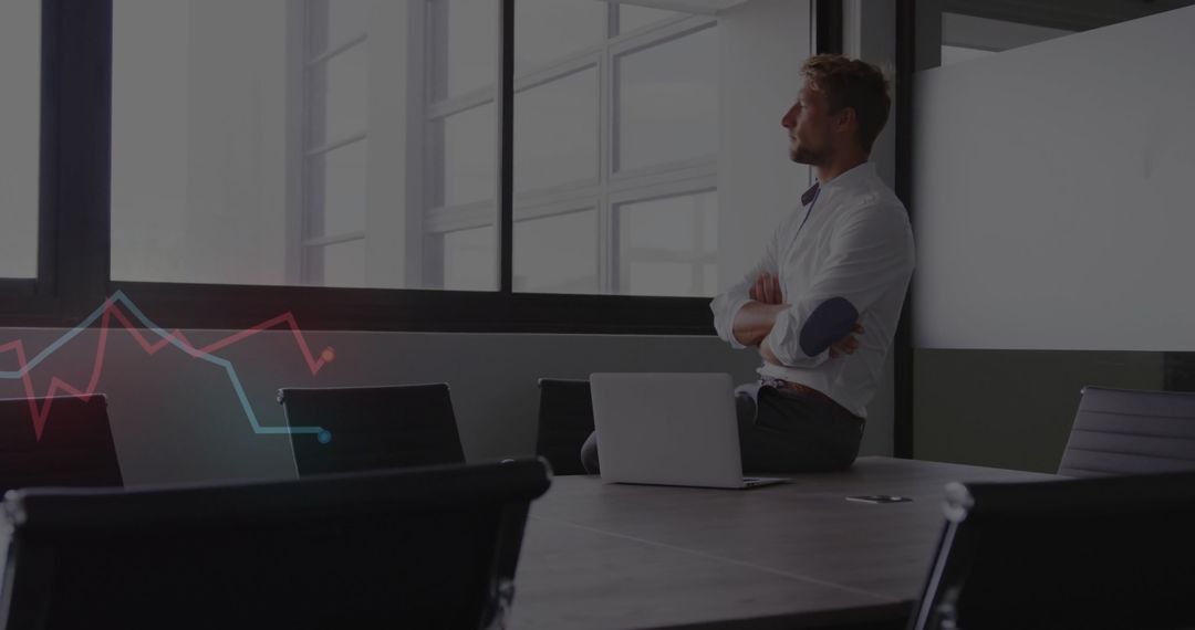 Business Executive Analyzing Data at Modern Conference Table