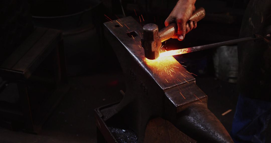 Blacksmith forging glowing steel on anvil, hammer striking metal with sparks flying