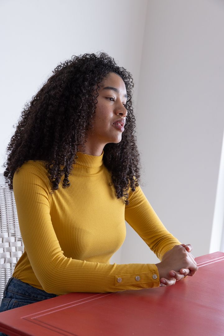 Casual Relaxation at Red Table with Natural Lighting