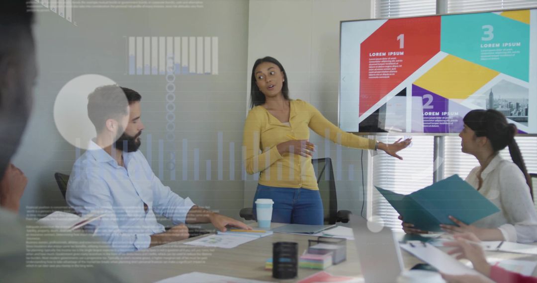 Young professional presenting data to team in modern meeting room with slide deck