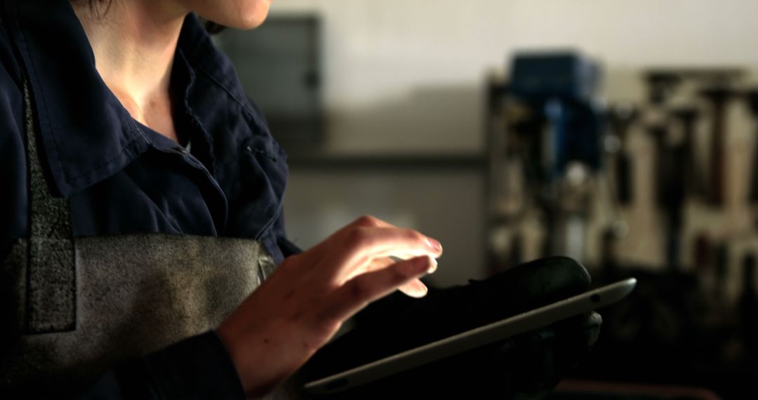 Factory Worker Using Tablet Indoors for Quality Control - Free Images, Stock Photos and Pictures on Pikwizard.com