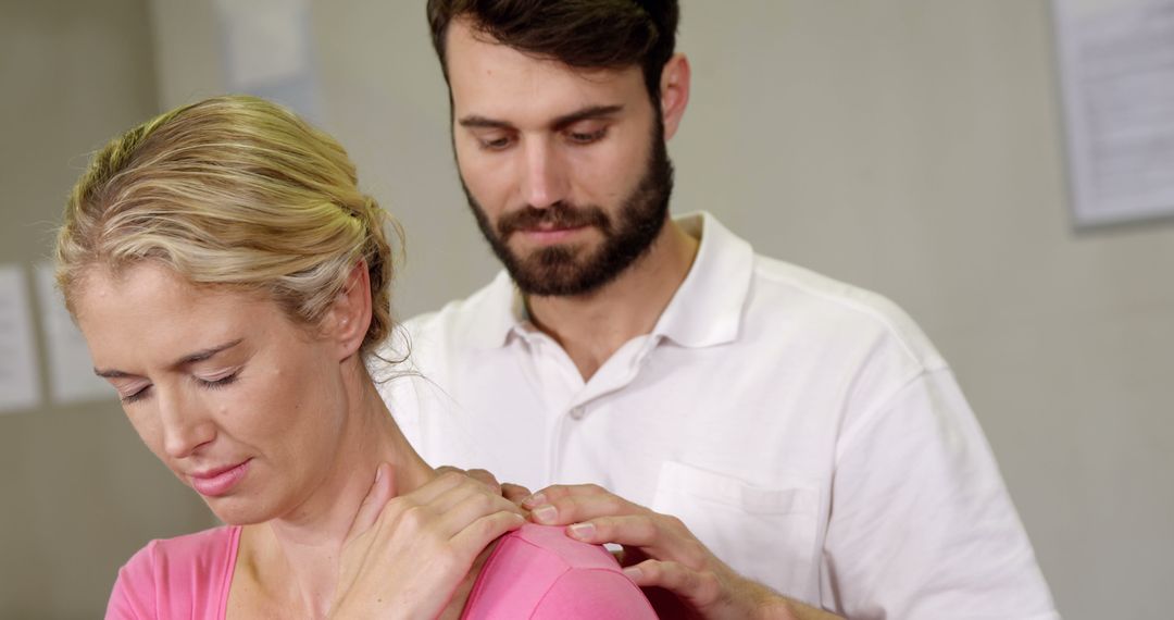 Physiotherapist Conducting Therapeutic Back Session with Patient
