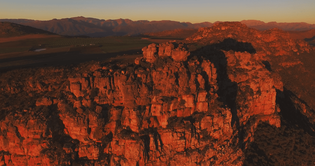 Sunset Over Rocky Mountain Range with Warm Glowing Colors