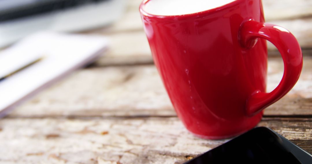 Red Coffee Mug and Smartphone on Rustic Wooden Table - Free Images, Stock Photos and Pictures on Pikwizard.com