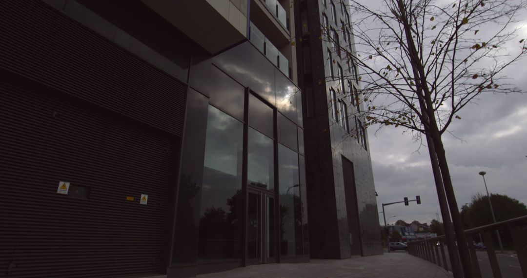 Modern Grey Office Building on Cloudy Day