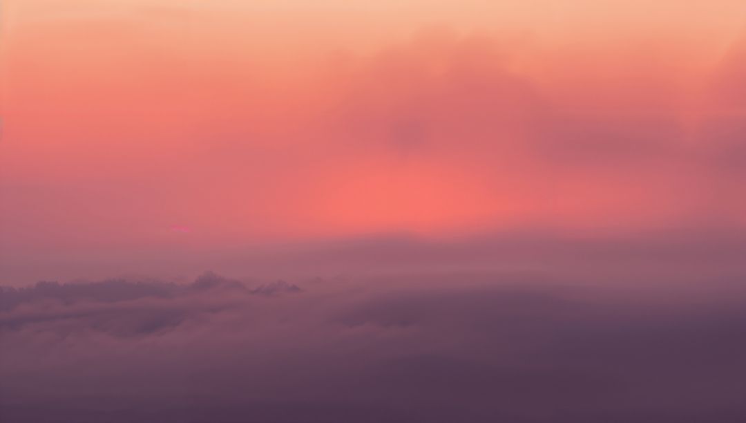 Majestic Purple Clouds with Sunrise Glow in High Altitude View