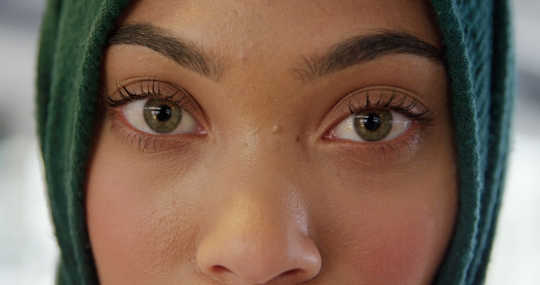 Close-Up of Woman's Eyes with Green Headscarf and Natural Makeup - Free Images, Stock Photos and Pictures on Pikwizard.com