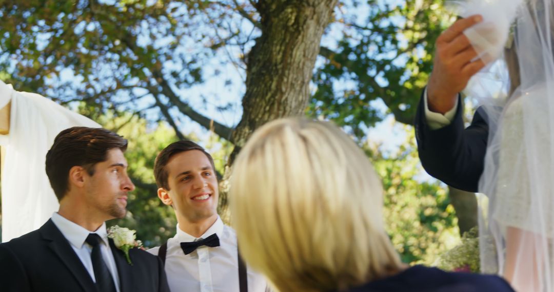 Groom and Best Man Smiling During Outdoor Wedding Ceremony - Free Images, Stock Photos and Pictures on Pikwizard.com