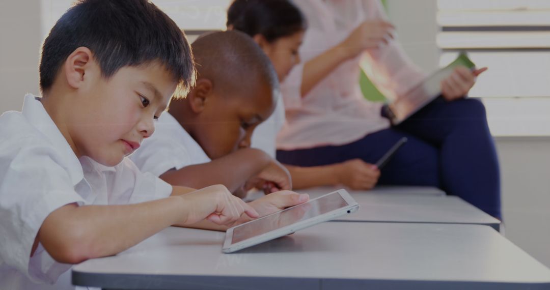 Diverse Students Engaged in Tablet Learning