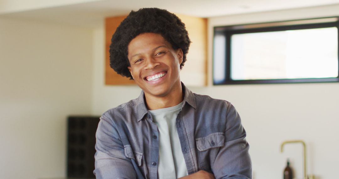 Smiling African American Man Relaxing in Modern Home Environment
