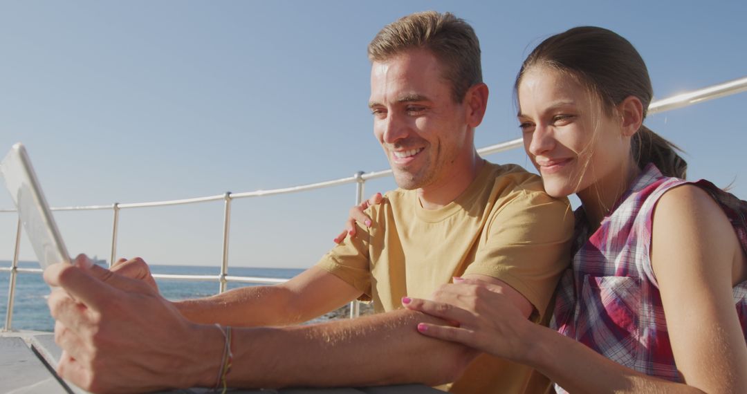 Happy Couple Embracing by Seaside Capturing Special Moments