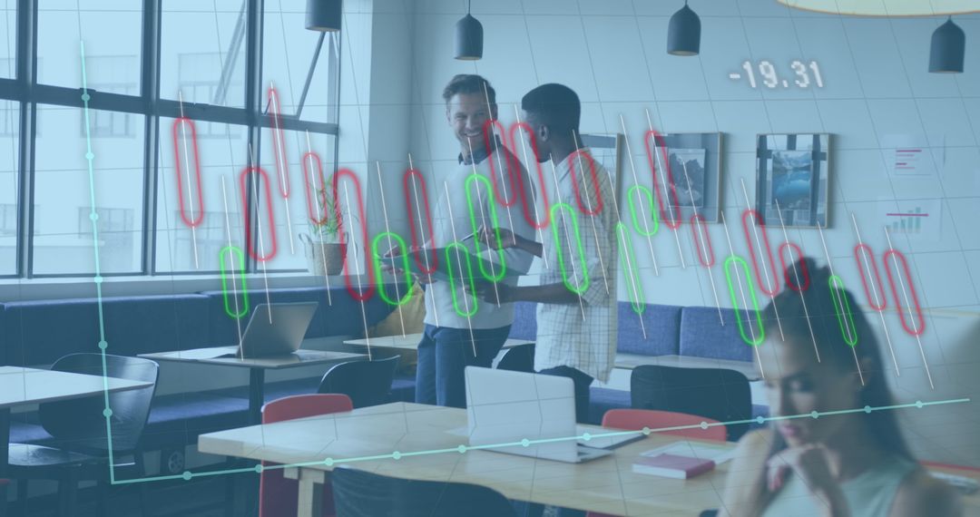 Diverse Professionals Analyzing Graphs in Modern Office Setting