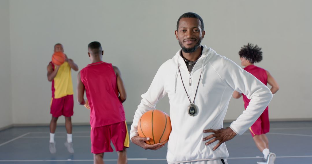 Confident Basketball Coach Leading Diverse Team Practice