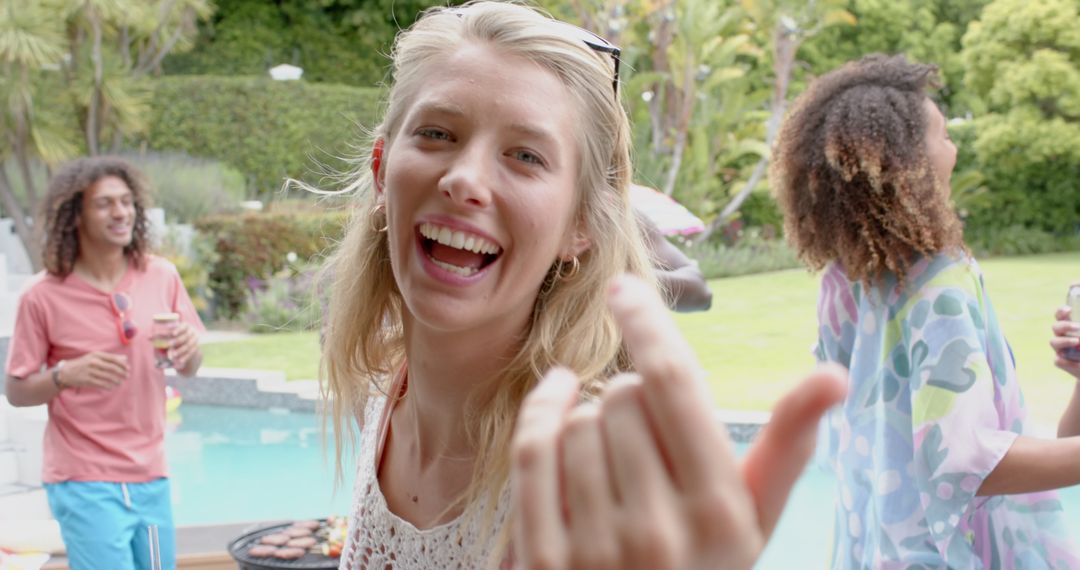 Joyful Outdoor Pool Party with Friends Enjoying a Barbecue