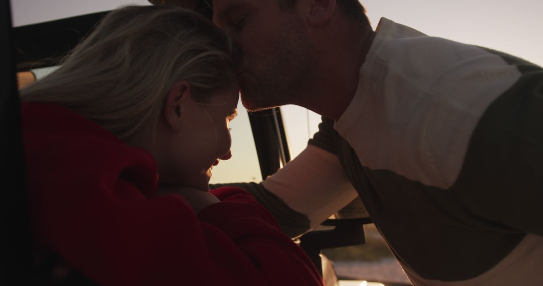 Couple sharing tender moment during sunset outdoors - Free Images, Stock Photos and Pictures on Pikwizard.com