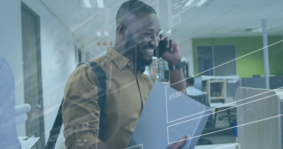 Smiling Businessman with Data Overlay Talking on Smartphone in Office