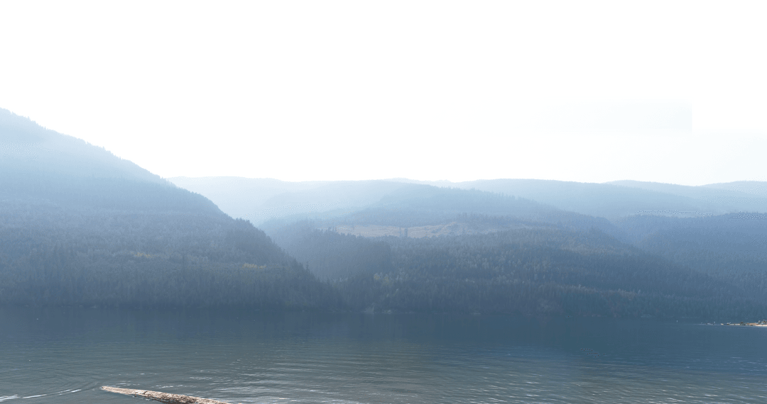 Transparent Misty River Scene with Tranquil Mountain Backdrop