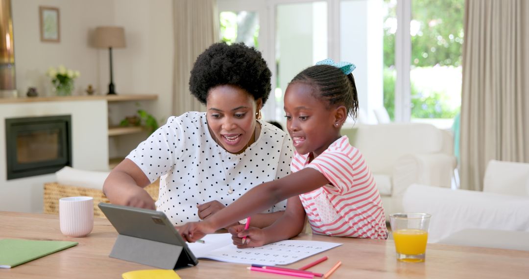 Mother and Daughter Learning Together with Tablet