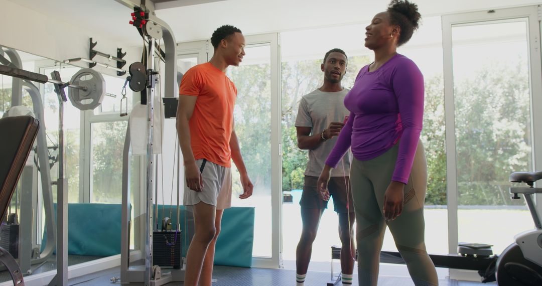 Group Training Session in Modern Gym with Personal Trainer