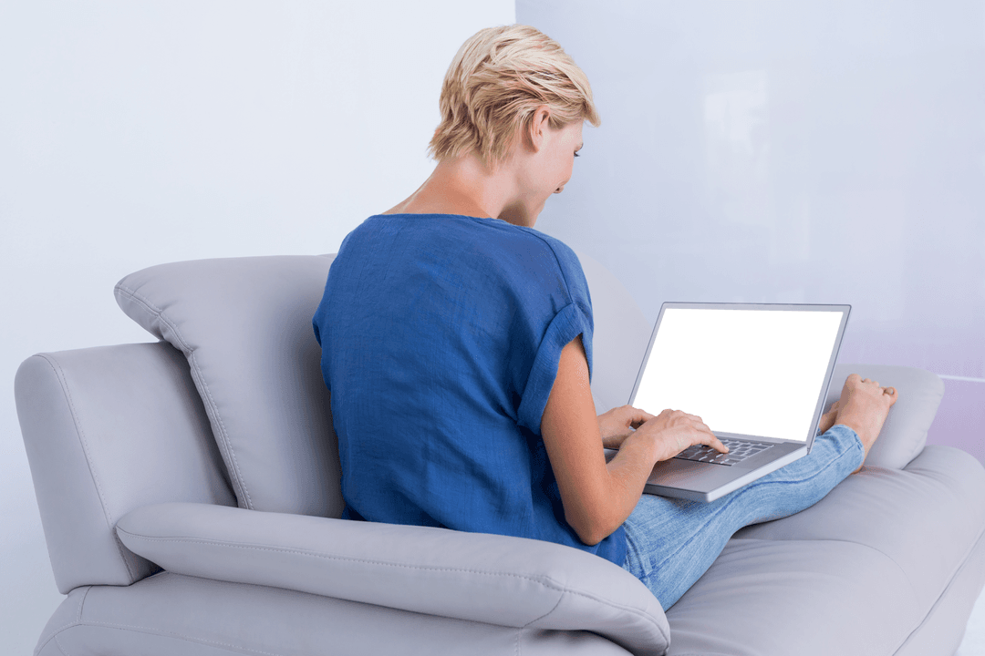 Blonde Woman on Couch Using Laptop with Transparent Screen