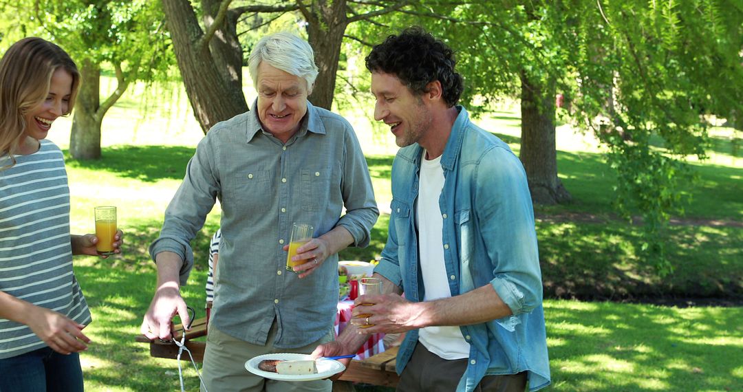 Multi-generational Family Enjoying Outdoor Picnic Together - Free Images, Stock Photos and Pictures on Pikwizard.com