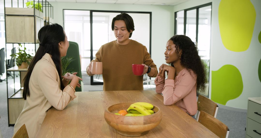 Diverse Coworkers Making Conversation During Office Break