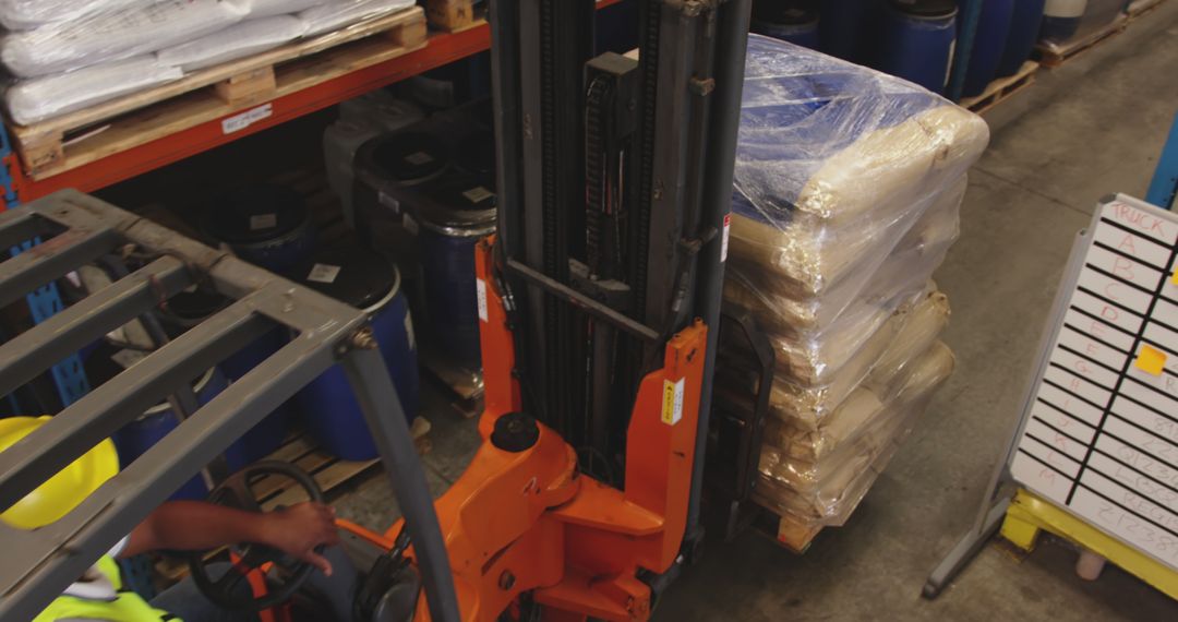 Warehouse Worker Using Forklift to Carry Large Pallets - Free Images, Stock Photos and Pictures on Pikwizard.com