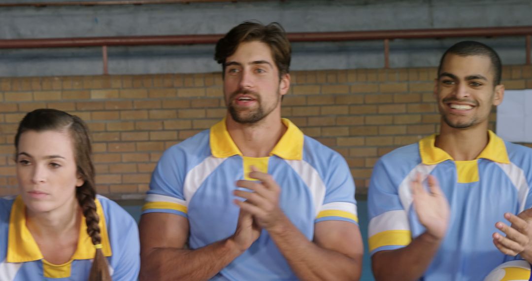 Diverse Team Cheering From Sidelines at Sports Event