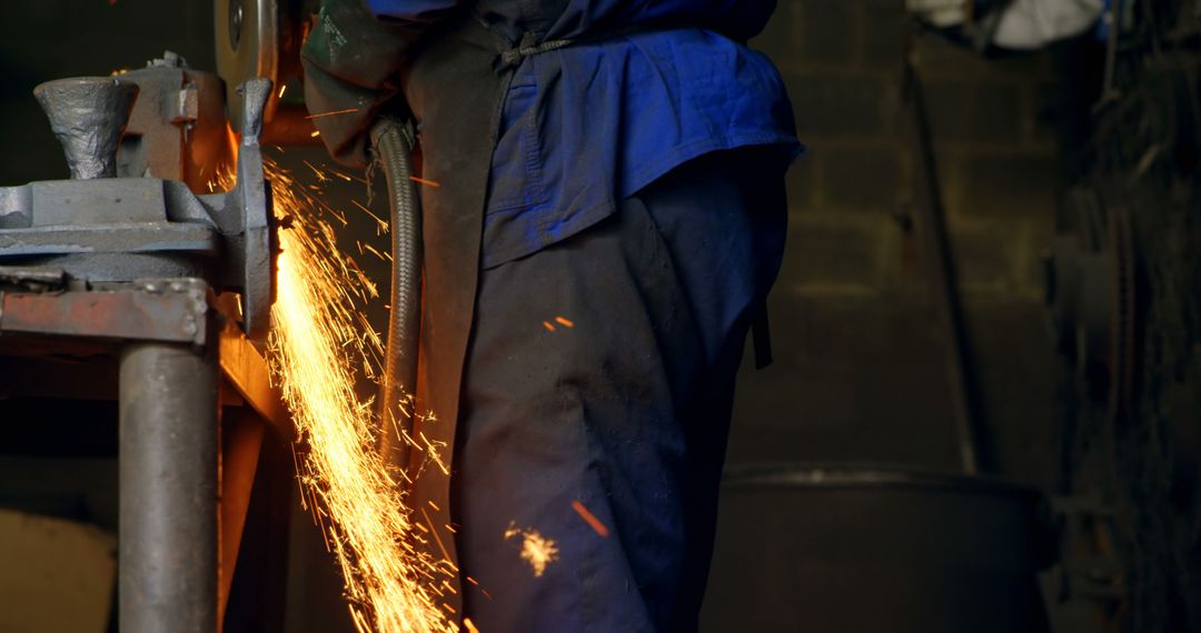 Worker Grinding Metal with Sparks - Free Images, Stock Photos and Pictures on Pikwizard.com