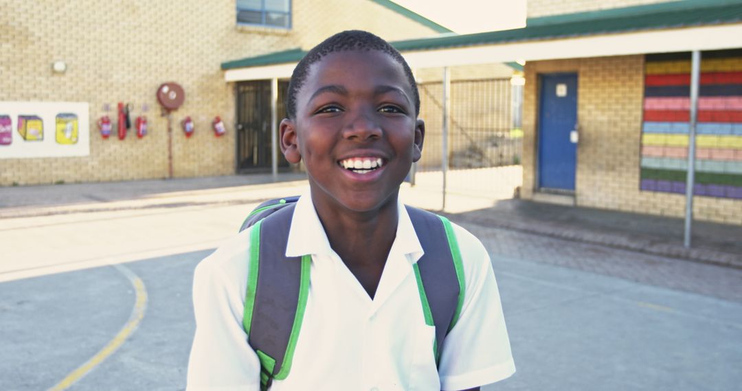 Joyful Schoolboy Smiling in Playground