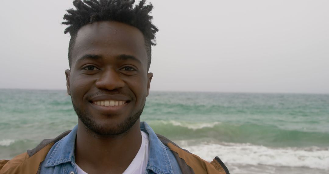 Smiling Man Enjoying Serene Beach Experience