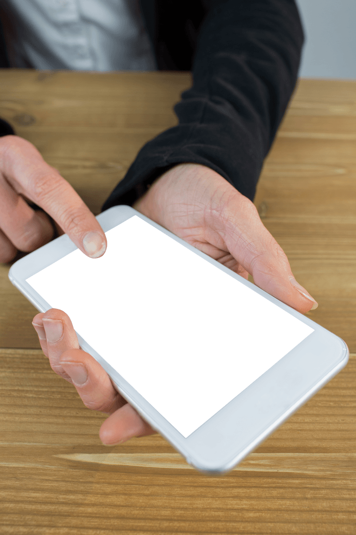 Businesswoman Using Transparent Digital Tablet on Wooden Table
