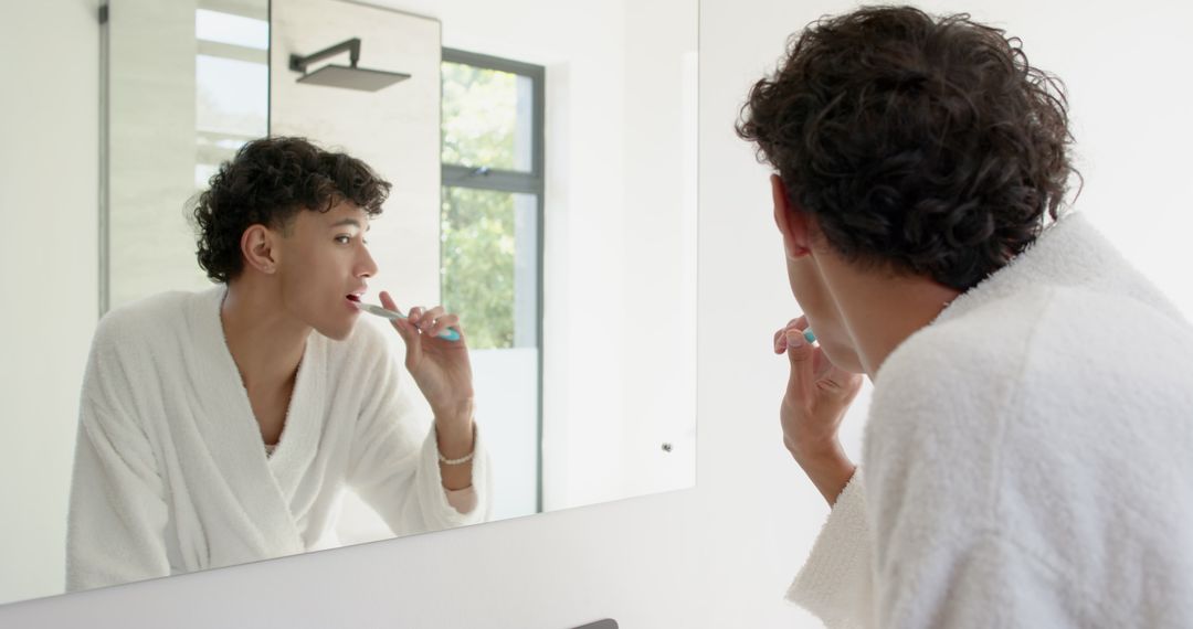 Man Brushing Teeth Performing Morning Routine in Modern Bathroom