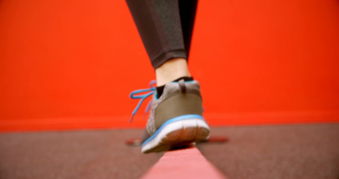 Woman Balancing on Line in Vibrant Fitness Studio