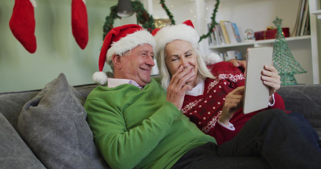 Senior Couple Enjoying Video Call in Festive Santa Hats at Christmas