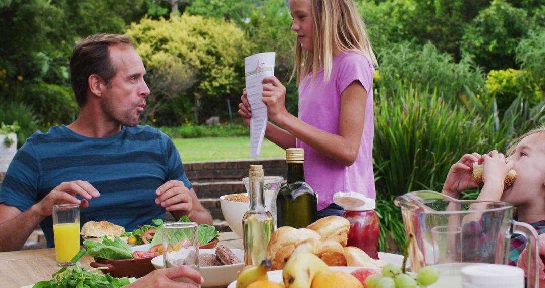 Family Enjoying Outdoor Breakfast in Garden - Free Images, Stock Photos and Pictures on Pikwizard.com