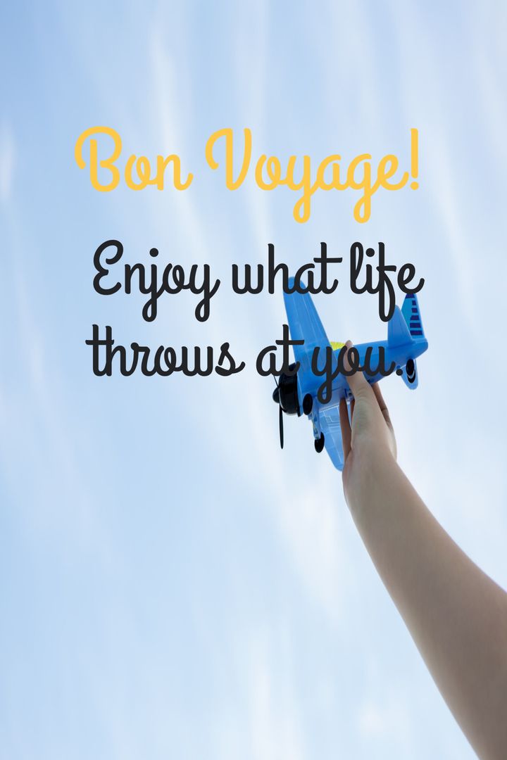 Hand Launching Toy Plane into Blue Sky