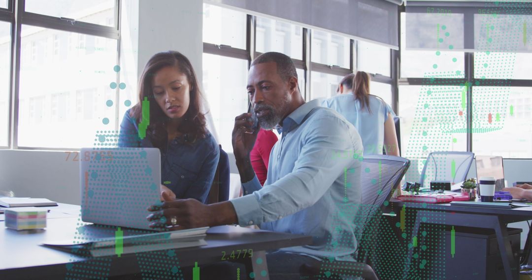 Professional Team Analyzing Financial Data in Modern Office Setting