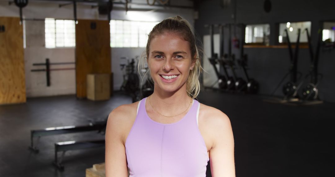 Smiling Woman Wearing Activewear in Gym - Free Images, Stock Photos and Pictures on Pikwizard.com