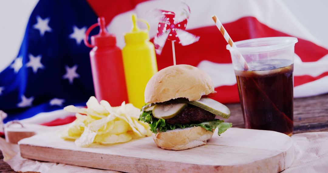 American Picnic with Burger, Chips, and Drink in Front of USA Flag - Free Images, Stock Photos and Pictures on Pikwizard.com