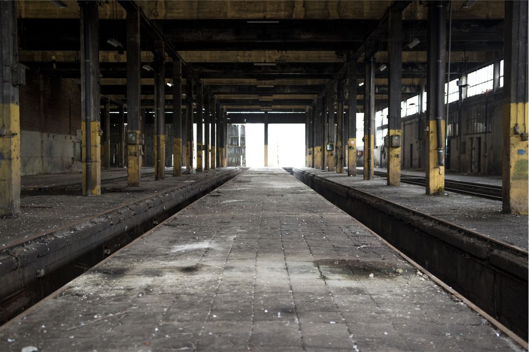 Abandoned Industrial Warehouse with Empty Rail Tracks - Free Images, Stock Photos and Pictures on Pikwizard.com