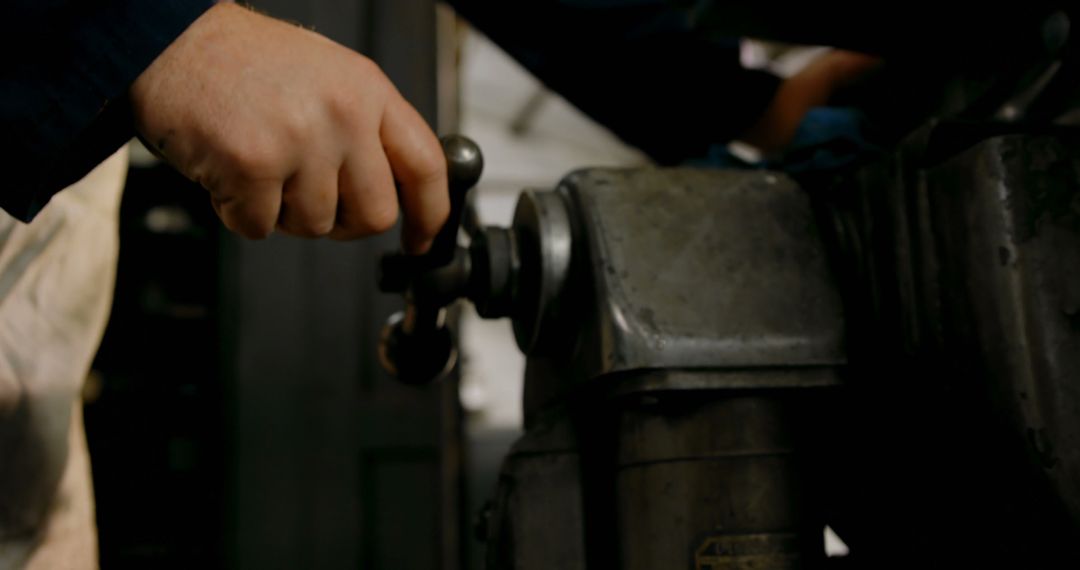 Worker Operates Industrial Machinery With Precision - Free Images, Stock Photos and Pictures on Pikwizard.com