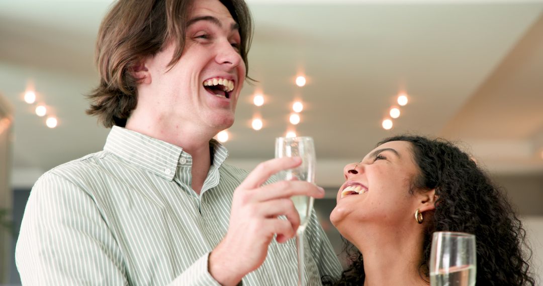 Couple Celebrating with Champagne at Home Party