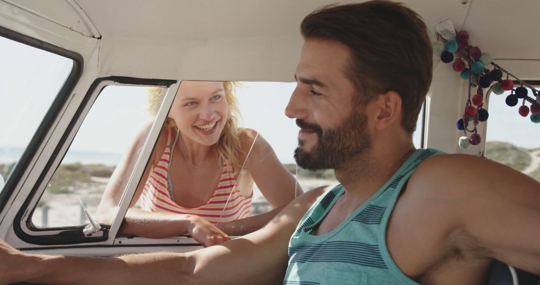 Joyful Couple Enjoying Road Trip in Campervan Adventure